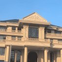 巴彦淖尔黄金麻别墅外墙干挂石材效果示例