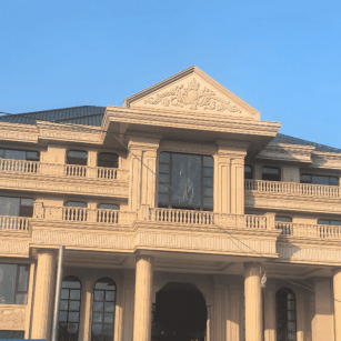 巴彦淖尔黄金麻别墅外墙干挂石材效果示例